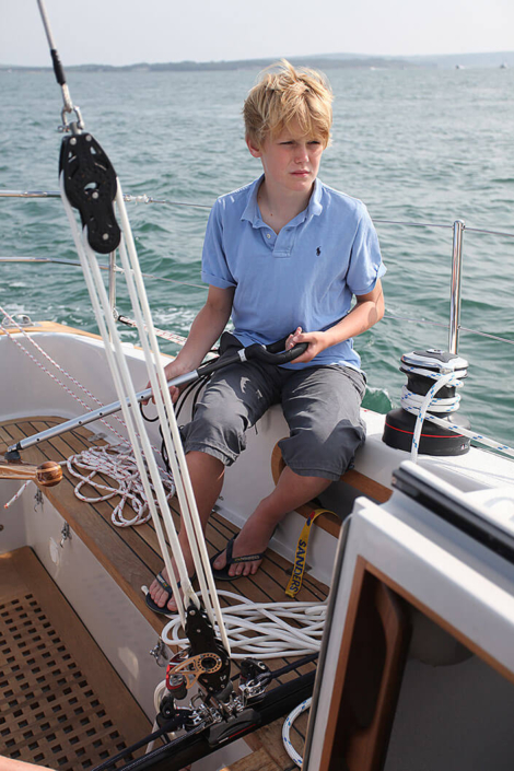 Jonah Rogers steering Contessa 32